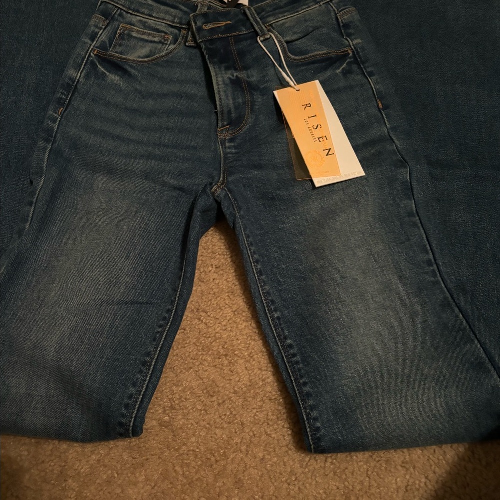 Risen jeans flare leg size 3. Never worn. Tags on.